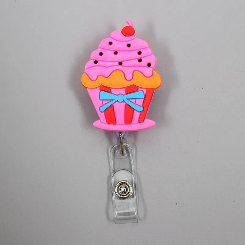 Add fun to your work or school day with this adorable 1PC Donuts & Cake Retractable Badge Reel. Perfect for kids, students, or nurses, it features a durable ABS reel, silica gel clip, and a 60cm retractable length. A cute, practical way to carry your ID or name tag with style!