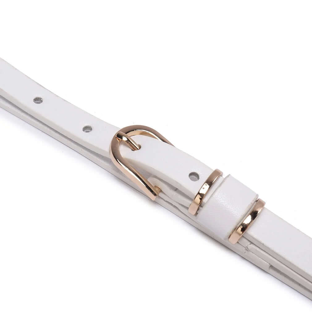 Elevate your outfits with the Beltox Women's Skinny Leather Belt, a versatile waist or hips ornament. Available in multiple colors with a chic gold alloy buckle, this belt complements dresses, jeans, slacks, and jackets. Designed for sizes 24-48 inches, it offers a perfect fit for both regular and plus sizes. Fast Amazon fulfillment and easy returns ensure a hassle-free shopping experience. Add a stylish touch to your wardrobe with this essential accessory!